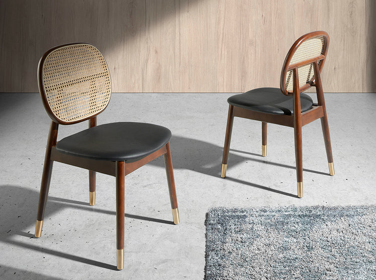 Chair upholstered in leatherette with rattan backrest and walnut wood legs - Angel Cerdá