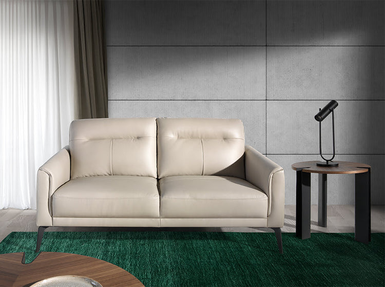 2 seater sofa upholstered in taupe grey leather and black steel legs - Furniture of design. Angel Cerdá