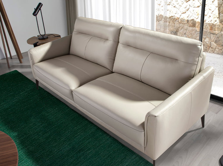2 seater sofa upholstered in taupe grey leather and black steel legs - Furniture of design. Angel Cerdá