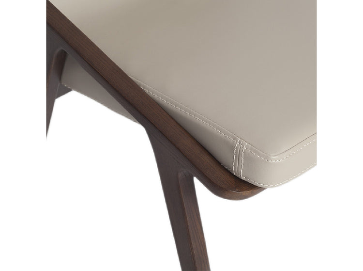 Chair upholstered in leatherette and solid walnut wood frame