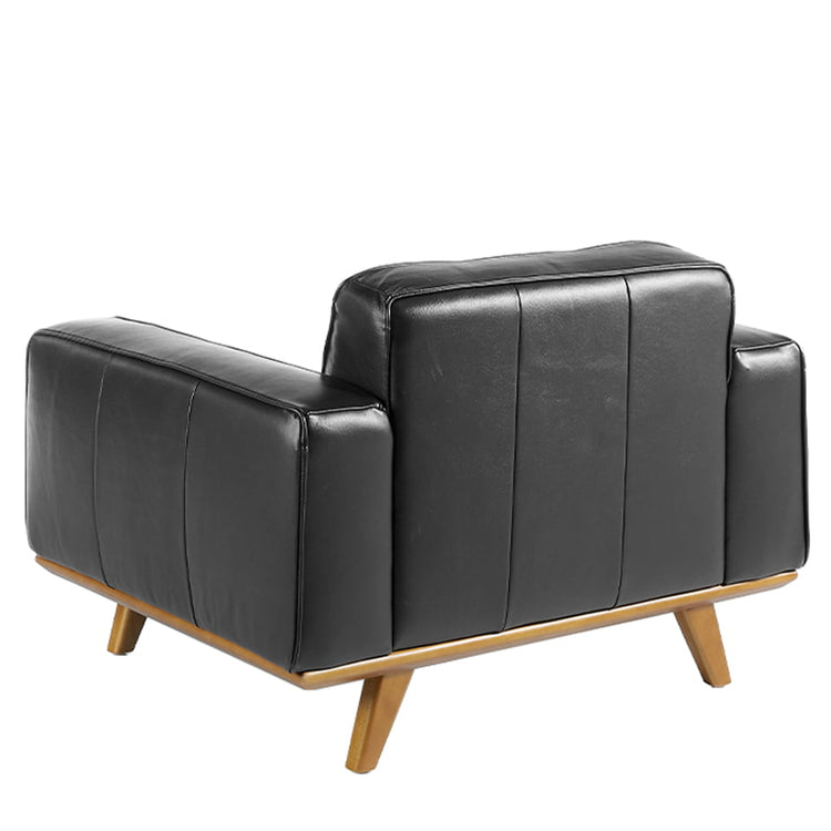 Leather upholstered armchair with solid walnut legs - Angel Cerdá, S.L.