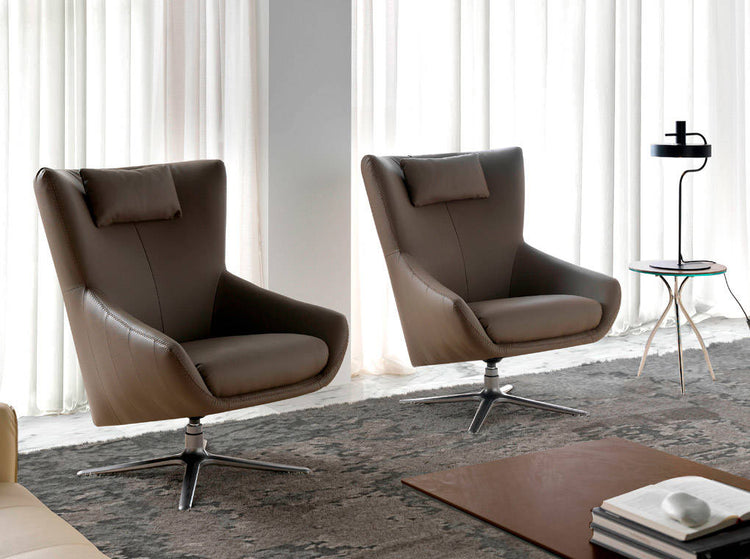 Upholstered in leather armchair with stainless steel - Angel Cerdá S.L