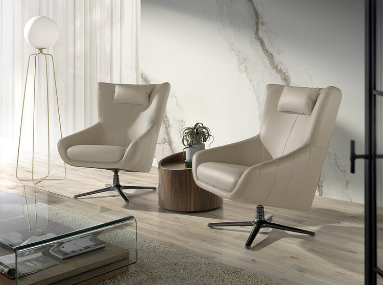 Swivel armchair with cushion upholstered in leather