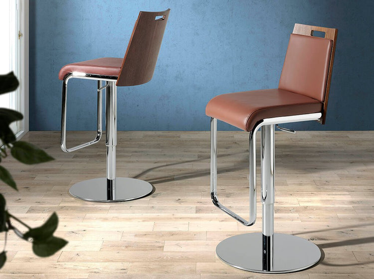 Stool upholstered in leatherette with chromed steel frame